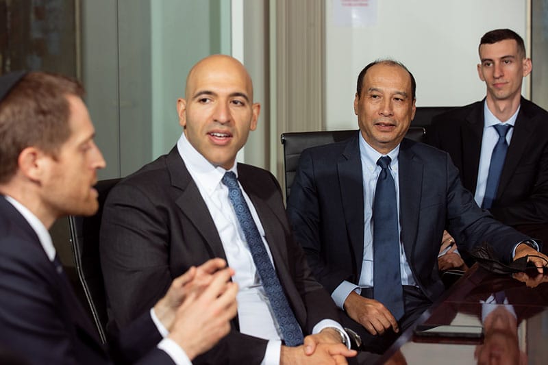 The criminal defense attorneys at a qualified criminal defense firm discussing